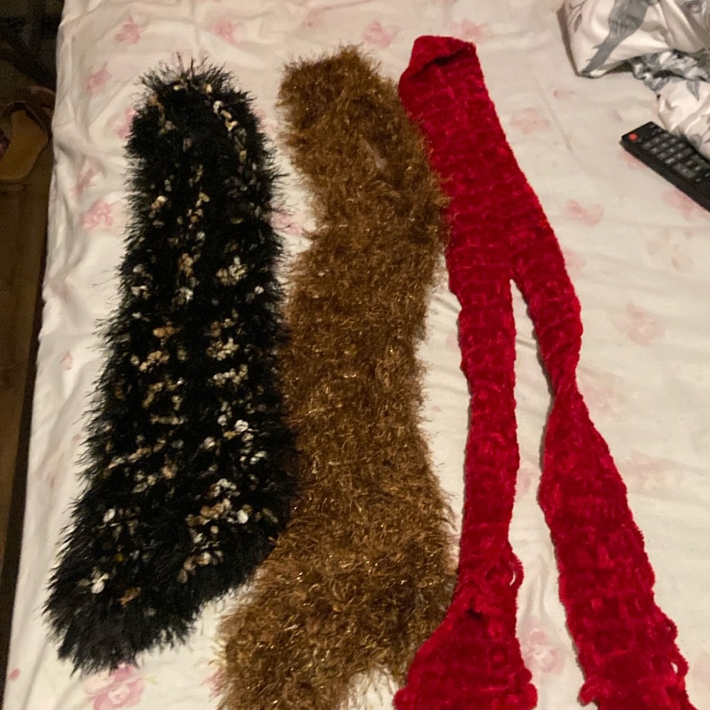 3 small scarfs. Enough to wrap around neck once. All handmade.